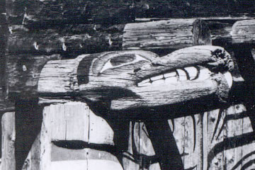 Close up of carved sea lion heads on Haida House Beams