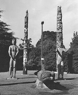 Eagle figure on pole surrounded by other exibits in the park