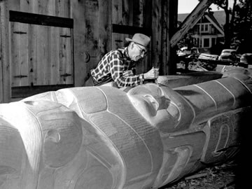 Mungo Martin carving a Haida style mortuary pole