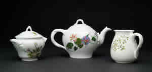 Tea pot and sugar and creamer.