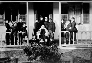 Lady Amelia on the porch of her home with four generations of descendants