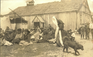 Cloth is distributed during a memorial potlatch for Ida Jackson